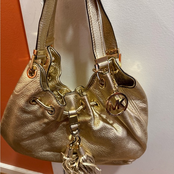 Michael Kors Handbags - Michael Kors Gold Shoulder Bag with Tassel
